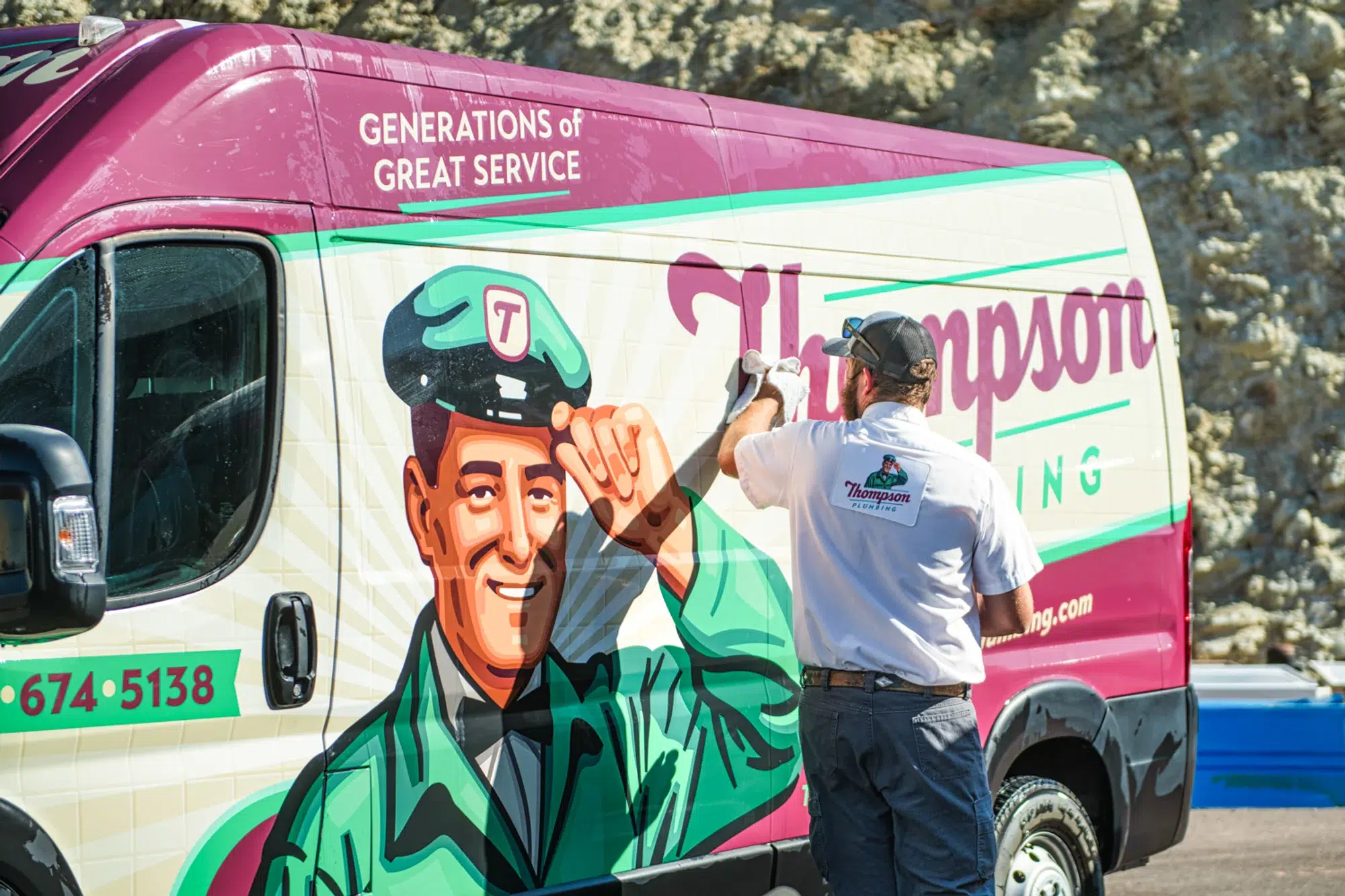 Thompson van being cleaned by an employee