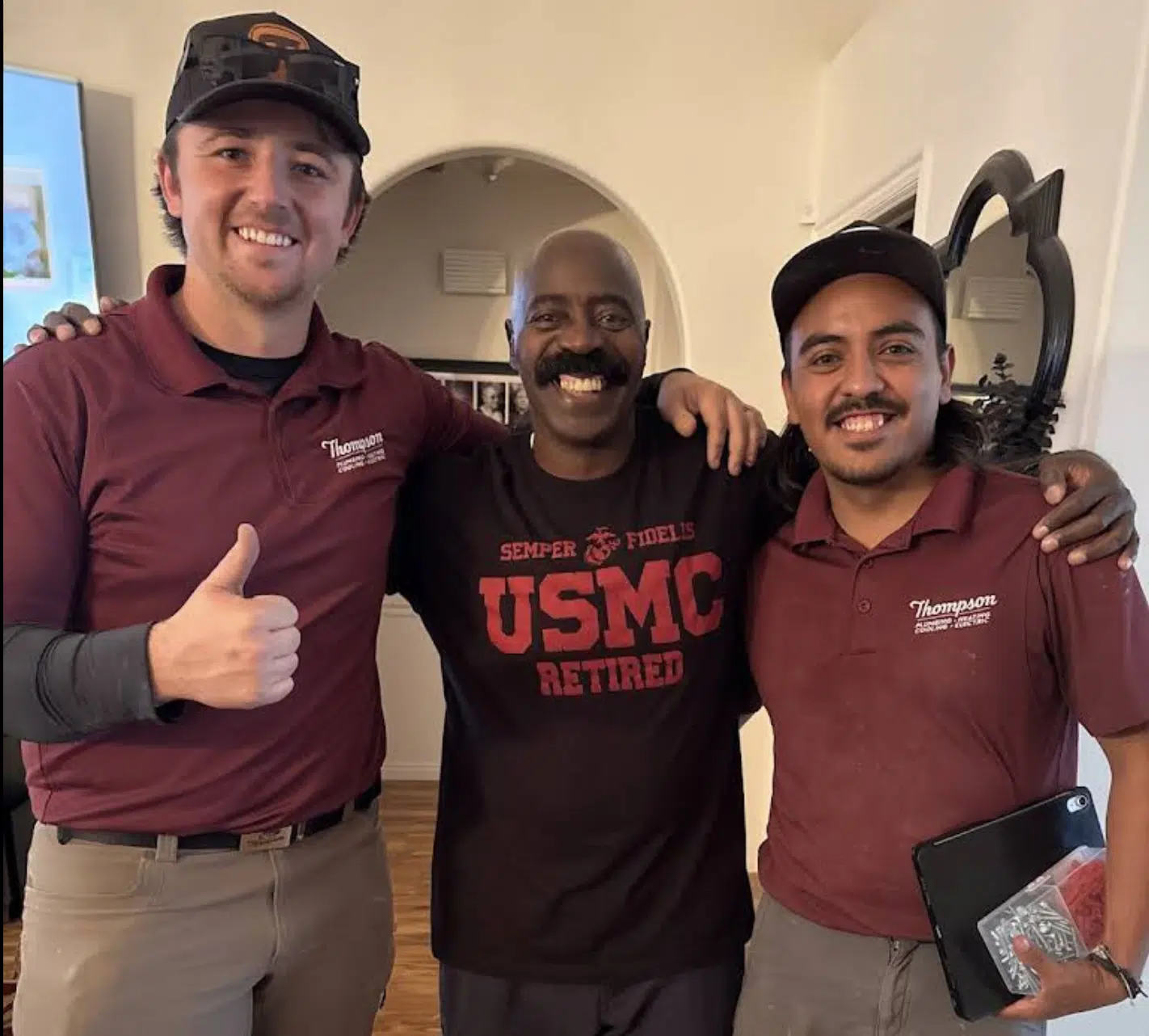 Thomson HVAC team with Marine veteran after HVAC service